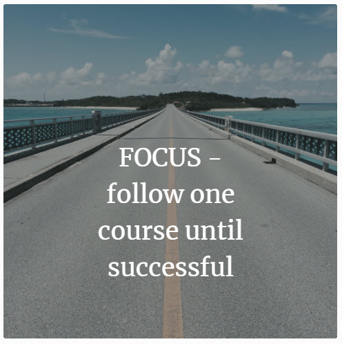 This is a road with the words Focus follow one course until successful written on it